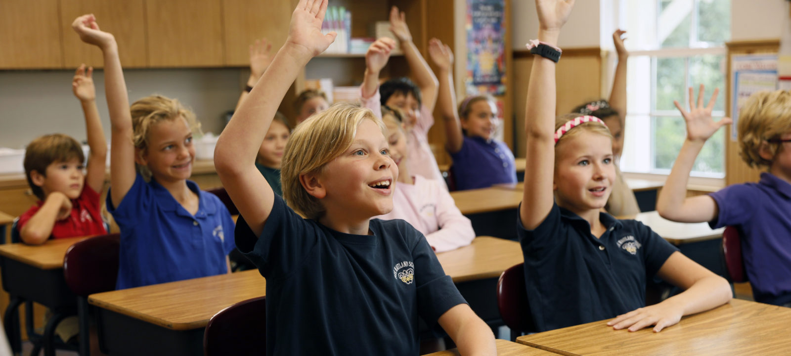 Kids raising hands